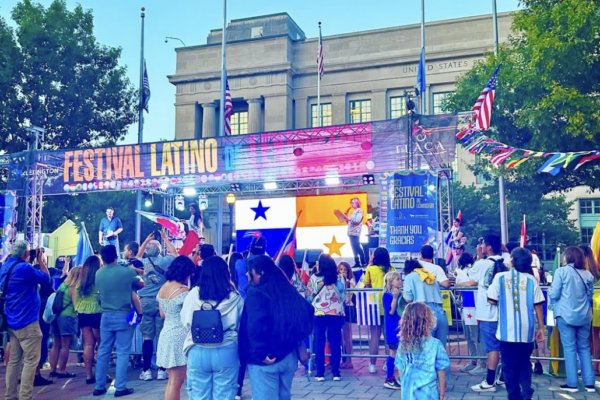 Families celebrating Latin music, dance, food at Festival Latino.